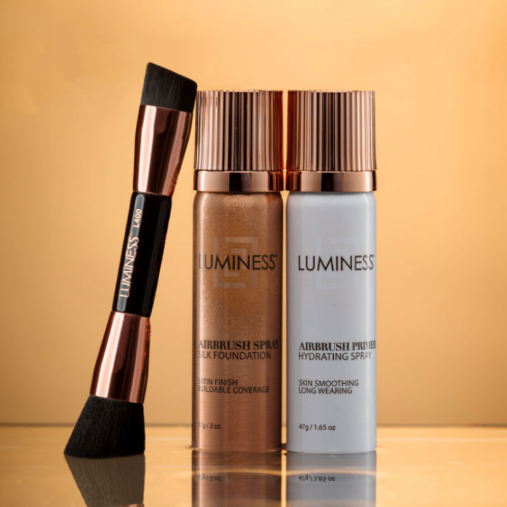 Photo of a brush and two cans of airbrush foundation and primer