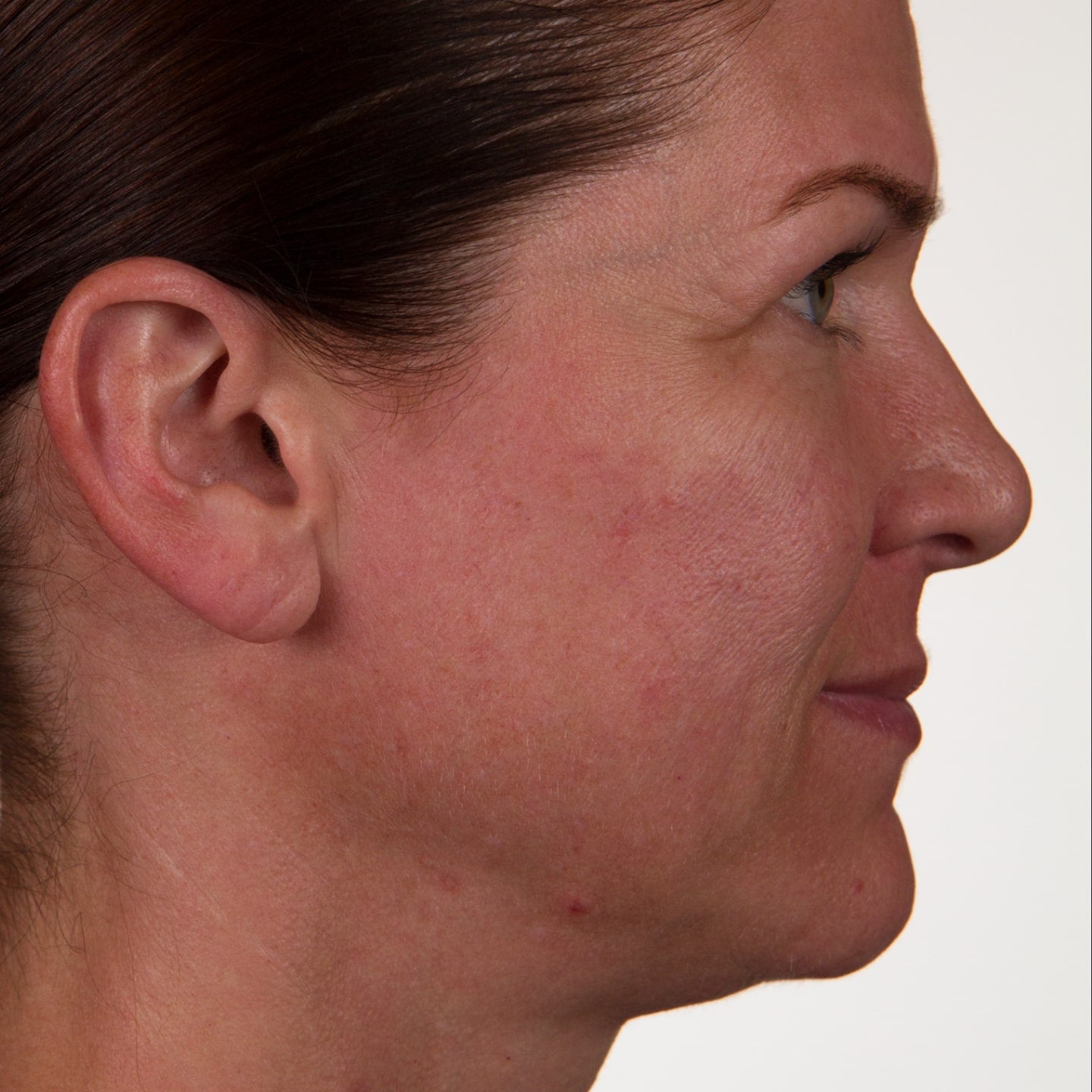 Close up photo of a woman's side profile of her face