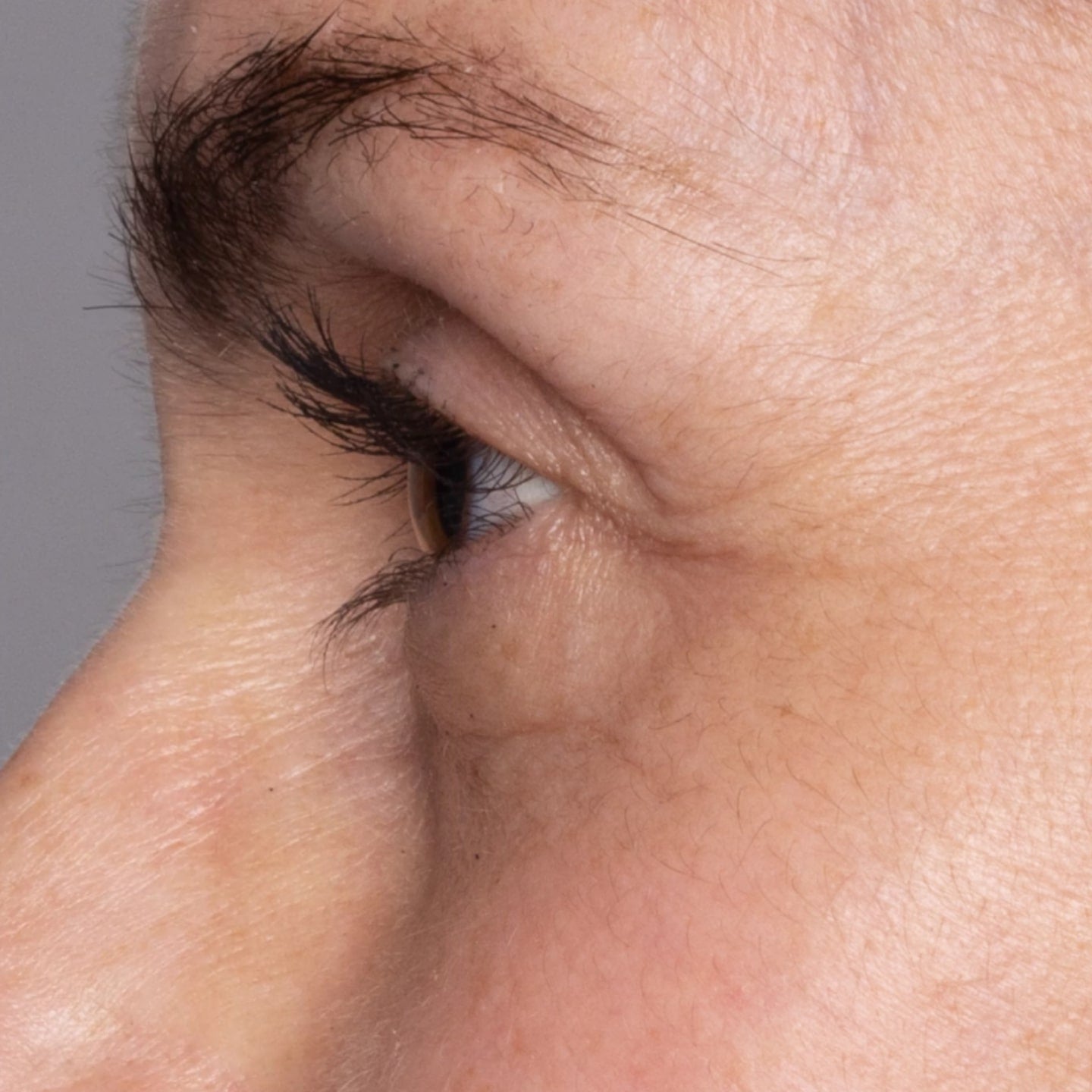 Close up photo of the side profile of a woman's eye